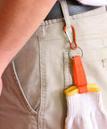 Person using 20 Pack Glove Clips For Belt Loops, Heavy Duty Glove Holder Clips in orange, attached to belt, securing gloves