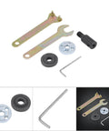 Front view of an angle grinder chuck kit showing two spanner wrenches, shaft adapter, flange, rubber seal, and hex key.