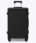 Front view of black Nobl Travel ribbed hard-shell luggage with extended telescoping handle and four spinner wheels.