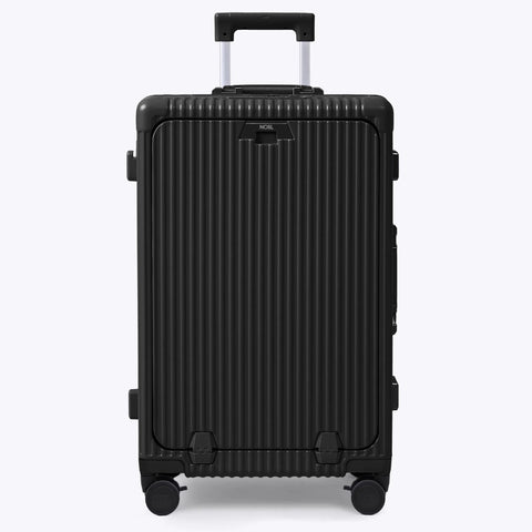 Front view of black Nobl Travel ribbed hard-shell luggage with extended telescoping handle and four spinner wheels.