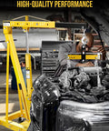 Heavy Duty Bad Boy Hydraulic Shop Crane Doubles As An Engine Hoist With Six Rolling Casters in use lifting a car engine.