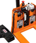 Heavy Duty Four Thousand Lb Self Propelled Electric Pallet Jack With 27 By 45 Inch Stainless Forks and electric controls showing battery system.