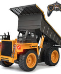 Remote Control Dump Truck For Kids And Toddlers, Realistic RC Construction Vehicle with raised bed and remote, black design.