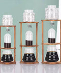 Game Changer Cold Brew Drip Tower With Adjustable Flow Control For Smooth Homemade Iced Coffee And Refreshing Chilled Tea No Sweat Kitchen Brewer For Real Barista Vibes Daily with ice and brewed coffee on display.