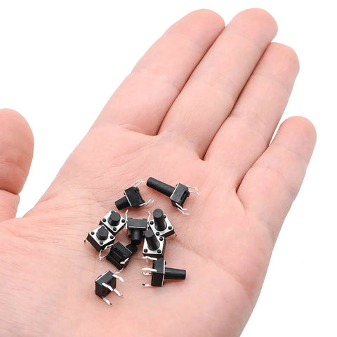 Person holding Micro Momentary Tactile Push Button Switch Kit Dope 200 Pc Assortment, 4 Pins, mixed sizes 5mm to 13mm, in a hand.