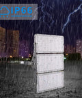 Killer Brightness 300W LED Work Lights Outdoor Flood Light Fixture IP66 Waterproof in rain against city skyline at night.