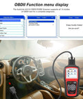 AL519 OBD2 Scanner Pro Car Diagnostic Tool displayed in car interior with menu options for full OBDII and CAN read functions.