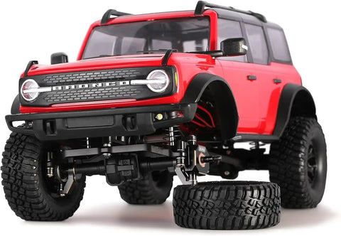 RC crawler with beefy brass caster blocks C hubs and steering knuckle kit for TRX4M 1/18 upgrades, red body, black coat