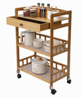 Heavy Duty Carbonized Bamboo Rolling Cart With Whisper Quiet Caster Wheels Plus Roomy Storage Drawers Easy Glide Mobile Kitchen Sidekick For Coffee Bars And Daily Grind Setup with drawers and kitchen supplies.