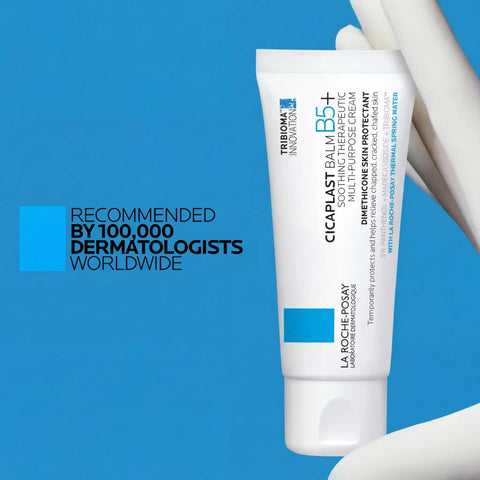 Ultimate Go To Healing Balm With Vitamin B5 Soothing Cream For Dry And Irritated Skin in white tube on blue background.