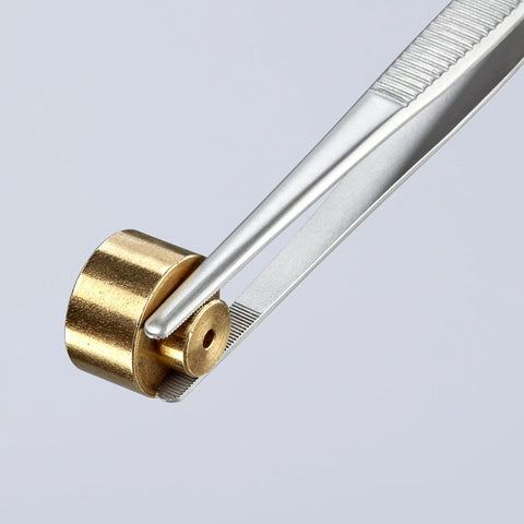 Precision Tweezers With Approx 30 mm Round Tips And Fine Serration, Nickel Plated Chrome Finish gripping a brass part