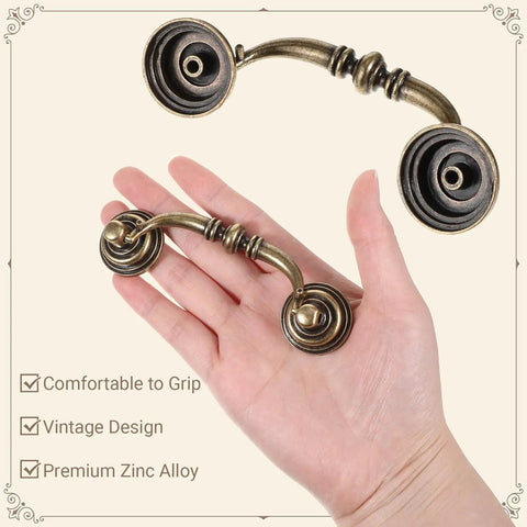 Hand holding Antique Bronze Drop Bail Drawer Pulls Set Of 10 With 4.5 Inch Total Length And 3.5 Inch Center, Vintage Cabinet Handles