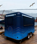 Solid As A Rock Mobile Food Trailer And Rolling Cart Combo Crafted For Coffee Ice Cream Sales Quick Hustle Setup That Grinds Like A Dream On Busy Weekends, blue trailer by the water.