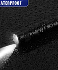 Mini LED Flashlight With Clip, Pocket Sized And Water Resistant, Aluminum Penlight shining on wet surface in dark setting