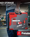 Person holding a case labeled 'Grease Gun 12000 PSI' in an industrial setting.