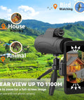 80x100 HD Monocular Telescope with Smartphone Adapter on Tripod for bird and wildlife watching in green landscape