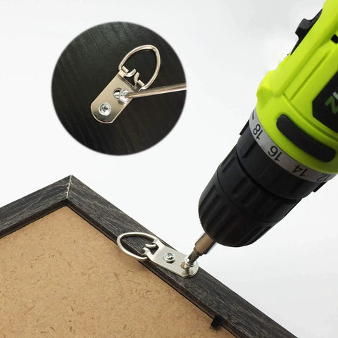 Heavy Duty D Ring Steel Picture Hangers With Screws 20 Pack Double Hole Clips being mounted on a frame with a drill