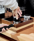 Sleek Espresso Knock Box Bundle Featuring A Rock Solid Wood Tamping Station and Heavy Duty Coffee Tamping Stand setup on countertop.
