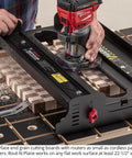 Person using Rout N Plane Bench Top Board Mill XL Router Sled For Flattening And Surfacing Cutting Boards And Glued Up Panels Up To 24 Inches Wide, DIY Friendly Easy To Use Heavy Duty Build USA Made on a wooden panel.