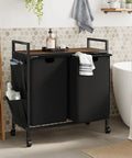 Double Laundry Hamper With Lid And Heavy Duty Wheels Rolling Laundry Basket Organizer With Top Shelf Iron Made Sorter With Two Removable Bags Large Capacity For Home Use Black in bathroom setting.