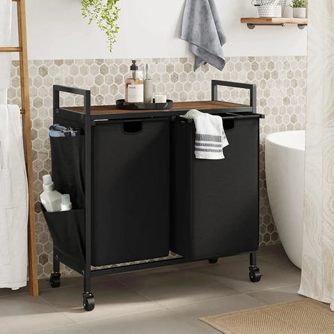 Double Laundry Hamper With Lid And Heavy Duty Wheels Rolling Laundry Basket Organizer With Top Shelf Iron Made Sorter With Two Removable Bags Large Capacity For Home Use Black in bathroom setting.