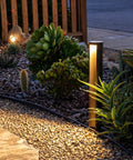 Low Voltage 5W Anti-Glare LED Path Lights With 5CCT Color Temperatures lighting a gravel garden path by plants at night