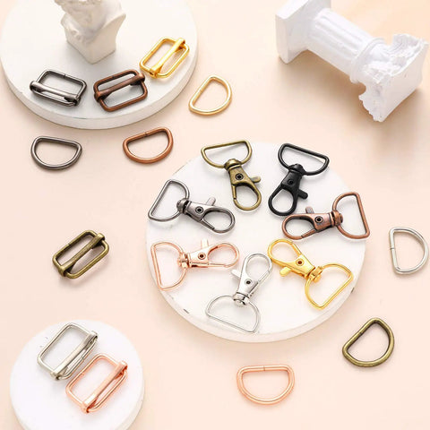 Slick D Rings Kit With Swivel Clasps Slide Buckles And Lobster Hooks For Handbags Lanyards Dog Gear And Craft Sewing Ninety Six Piece Set showing various hooks and rings on a pale background.