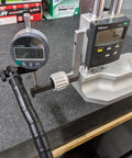DXphita disc brake rotor runout gauge set with 1'' digital indicator and Mitutoyo readout mounted on a locking vise.