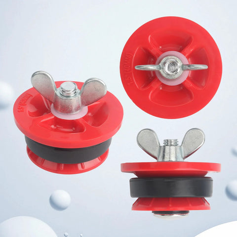 Three red plastic end-of-pipe gripper plugs with metal wing bolts and black seals, 1-1/2 in