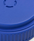 Close-up of blue lid on Heavy Duty Hand Held Spreader With Adjustable Hole Size For Seeds Fertilizer Salt Ice Melt And Pest Control Granules 2 Liter Capacity Includes Scoop Durable Garden Tool For Lawn Garden And Driveway Maintenance
