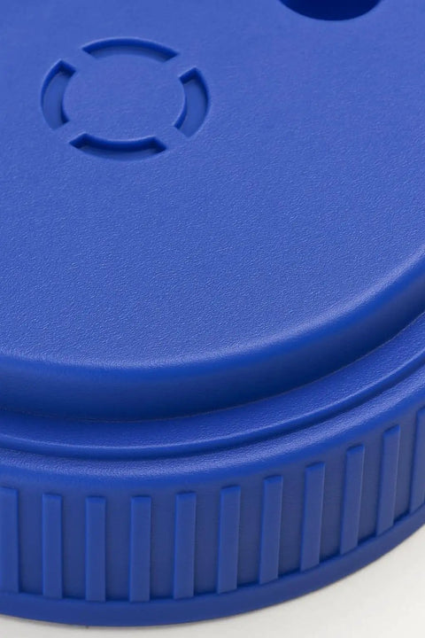 Close-up of blue lid on Heavy Duty Hand Held Spreader With Adjustable Hole Size For Seeds Fertilizer Salt Ice Melt And Pest Control Granules 2 Liter Capacity Includes Scoop Durable Garden Tool For Lawn Garden And Driveway Maintenance