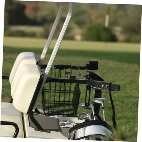 Golf cart side view with bag rack, seats, and visible countryside setting on grass.