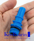 Heavy Hitter Evaporative Emission Control Valve PCV Valve in hand, blue plastic with rubber O-ring, for Ford vehicles.