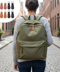 Woman with backpack featuring 10 Pack PU Leather Zipper Pulls Set Detachable Decorative Zipper Tabs for Luggage Backpacks