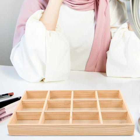 Knockout Solid Wood Jewelry Tray With 12 Grid Compartments, smooth polished finish on a chic vanity table.