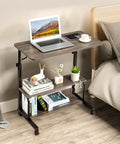 Unwind And Handle Daily Grind At This Grey Oak Rolling Standing Desk With Height Adjustable Top Smooth Gliding Wheels Grab And Go Mobility Side Hooks And Roomy Storage Shelves For Your Home Office Setup, featuring a laptop on a spacious top.
