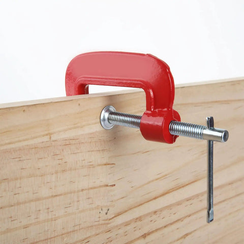 16 Pack 2 Inch C Clamps Set Beefy Heavy Duty Quick Grip Clamps With Throat Depth 1 3 16 Inch And 2 Inch Jaw Opening For Woodworking Welding Building Repair Projects, shown clamping a wooden board