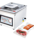 Front view of VEVOR chamber vacuum sealer, stainless steel with clear lid; two vacuum bags show steak and salmon