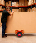 Beefy Heavy Duty Panel Dolly For All Terrain Use With 2 Wheel Slab Design And 10 Inch Solid Wheels, Supports Up To 1100 Lbs, man moving large board in warehouse
