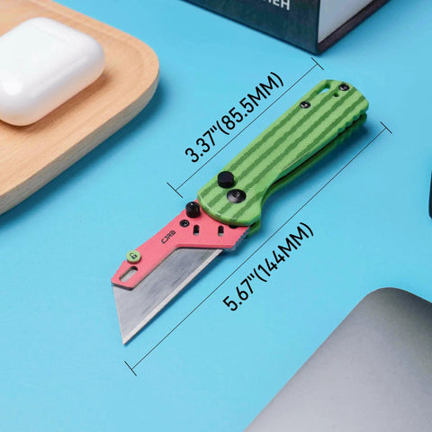 Slick Folding Utility Knife With Foolproof Toolless Blade Swap And Solid G10 Handle, 5.67" long, on a blue table.