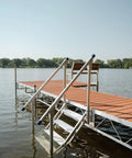 Heavy Duty Aluminum Dock Stairs With Five Wide Platforms And Twin Handrails for easy shoreline climbing by the water.