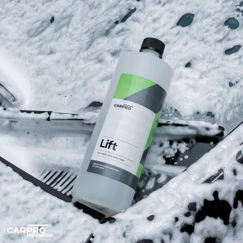 Lift Pre Wash Snow Foam Car Wash Soap That Dissolves Dirt And Grime Like A Boss For A Quick Touchless Clean bottle on soapy surface
