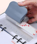 Super Handy Portable 3 Hole Puncher For Loose Leaf Paper A4 A5 B5 With 5 Sheet Capacity And Built In Positioning Ruler in use
