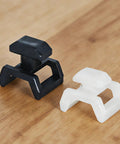 Black and white clips from 20 Pcs Series Cable Clips For European T Slot Aluminum Profiles And 3030 4040 Extrusions on wood surface