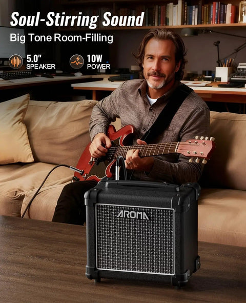 Man playing electric guitar with 10W Bluetooth Guitar Amp with a solid wood cabinet on table in living room.