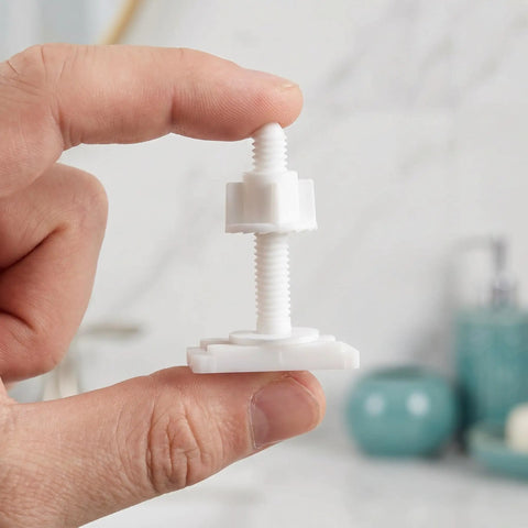 Hand holding a white bolt from a 10 Piece Toilet Seat Bolt Kit With Plastic Screws Nuts And Washers For Universal Toilet Lid Fit