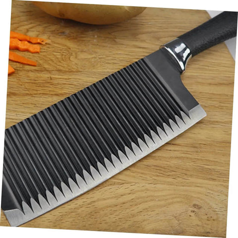 SOLUSTRE wavy crinkle slicer knife with stainless steel blade and black handle on wooden cutting board