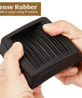 Close-up of hands holding Non Slip Rubber Furniture Caster Cup Three Inch By Three Inch Square Black Floor Protector showing dense rubber grip
