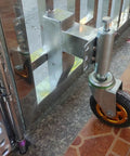 Friction Free 4 Inch Retractable Gate Casters With Heavy Duty Shock Dampening and Quick Flex Lifter for Dead Quiet Iron Gate Rolling Universal Swivel Wheels One Piece Graphite Gray mounted on gate.