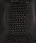 Close-up of BuckGuard 2.0 Retractable Gaff Guard stitching, showcasing durable material for lineman and arborist climbing gear.